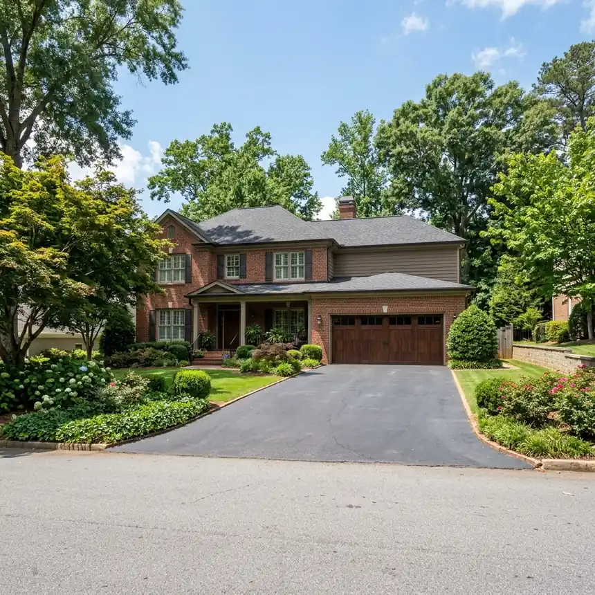 A home with a wide double garage door in the Kingsley area of Dunwoody